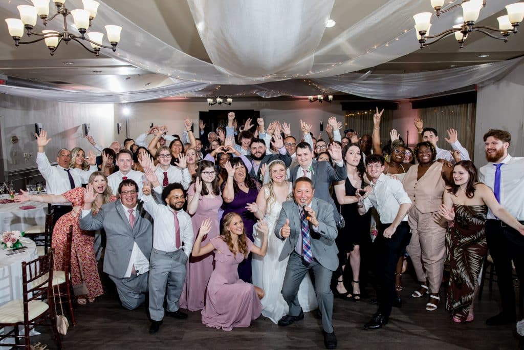 bride and groom posing with their wedding guests, Falcon's Fire Golf Club, Orlando, FL