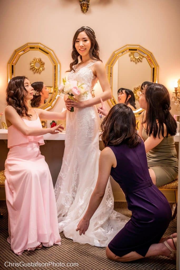 bride surrounded by her bridesmaids, in the bridal suite before the wedding, Gallery J, Orlando, FL