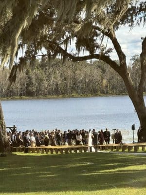 zoomed out photo of the wedding ceremony by the water, Orlando, FL