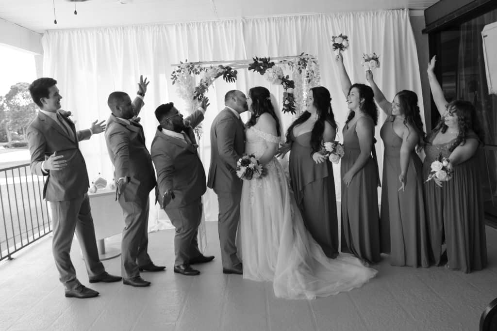 black and white photo, bride and groom with their wedding party, celebrating the wedding, Ventura Country Club, Orlando, FL