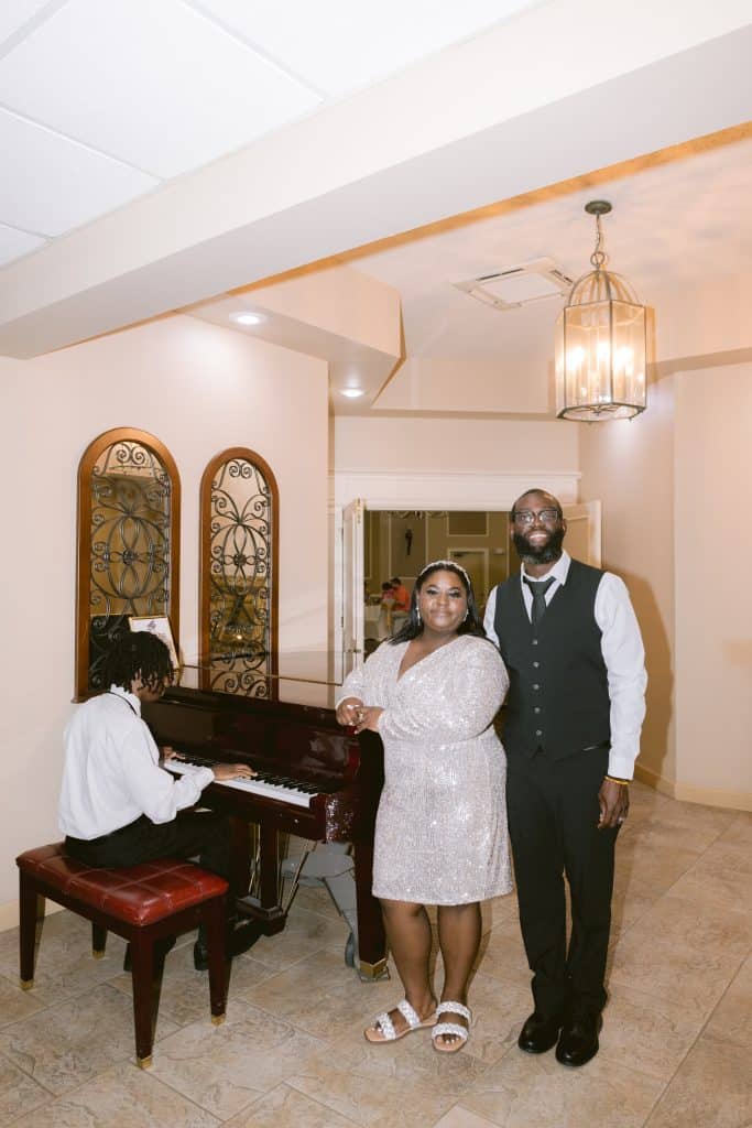 bride and groom posing by the piano, indoors, Ventura Country Club, Orlando, FL