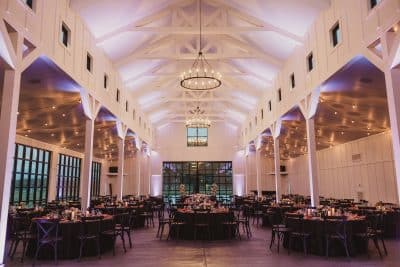 indoor view of reception area, great hall, tall ceilings, chandeliers, round tables, Scars Farm, Orlando, FL