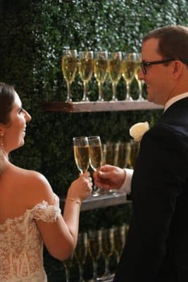 bride and groom celebrating with champagne, wedding reception, Orlando, FL