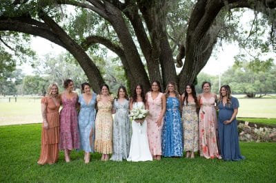 bride with the women in her life, outdoors under a large tree, The Colonial at Sunset, Orlando, FL