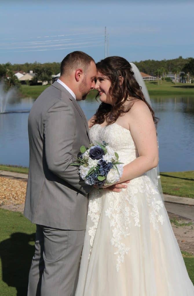 bride and groom looking into each other's eyes, near the water, Orlando, FL