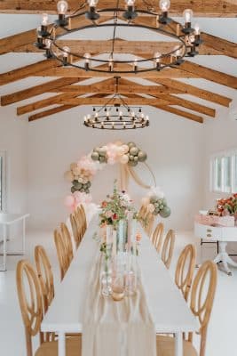 intimate wedding shower set up, long white table, wood chairs, Orlando, FL