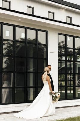 bride and groom standing outside their venue, Orlando, FL