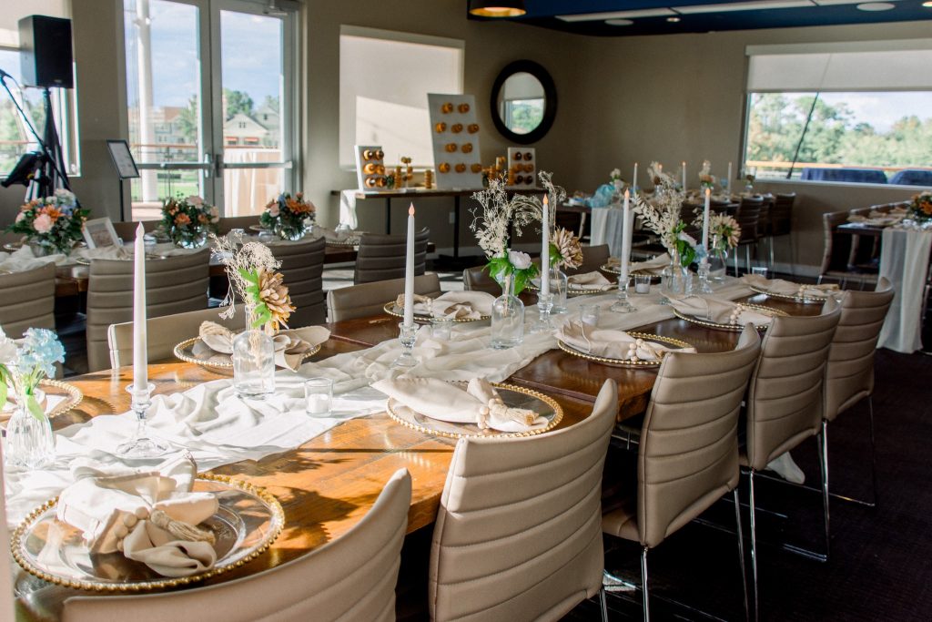 close up of a dinner reception table, inside deck, tall white candles, wooden table, white runner, Paddlefish, Orlando, FL