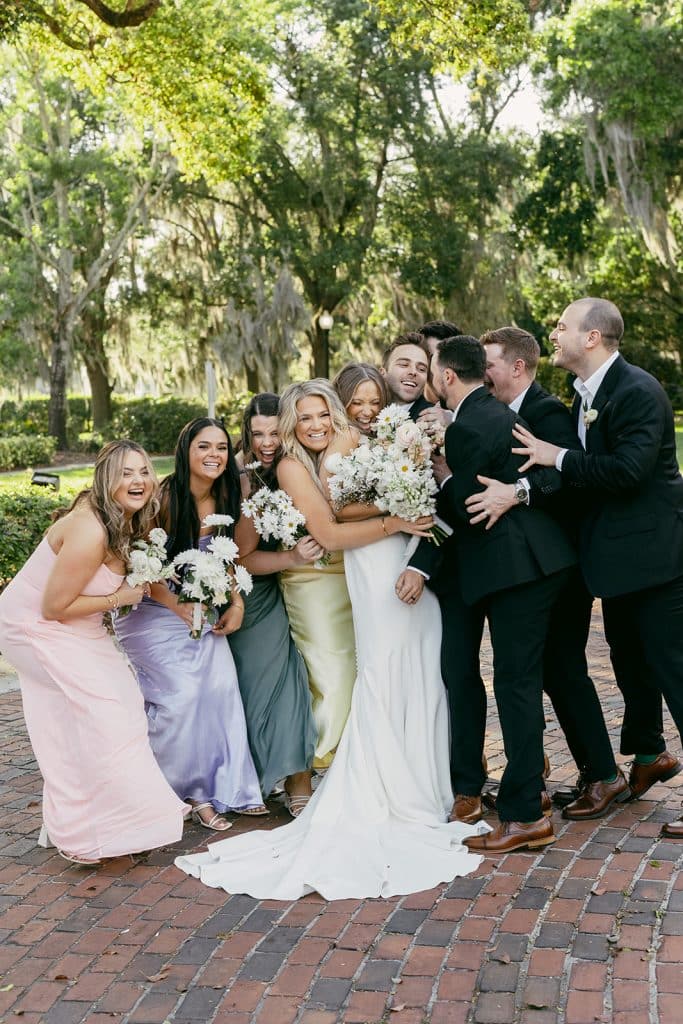 wedding couple with their wedding party, outdoors, brick walkway, Melanie Paige Events + Design, Orlando, FL