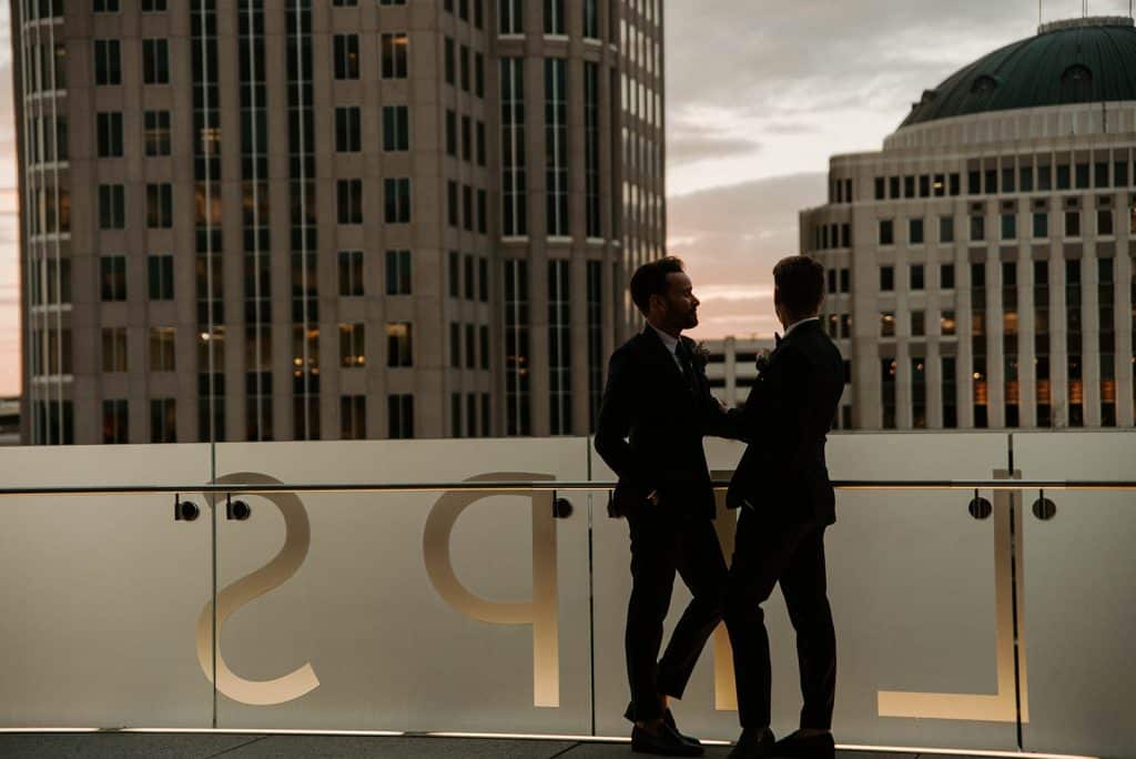 couple on the rooftop looking at each other, city buildings behind them, Dr. Phillips Center for Performing Arts, Orlando, FL