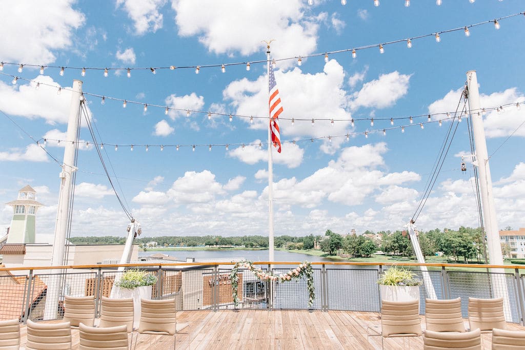 american flag flying on deck, daytime, set for a wedding ceremony, Orlando, FL