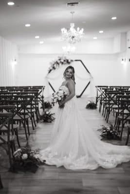 black and white photo, bride standing in the space for the wedding ceremony, in her gown, The Grand 721, Orlando, FL