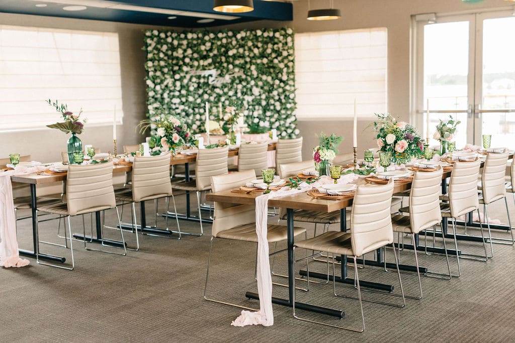 zoomed out photo of reception tables, pink runners, centerpieces and candles on the tables, Paddlefish, Orlando, Fl