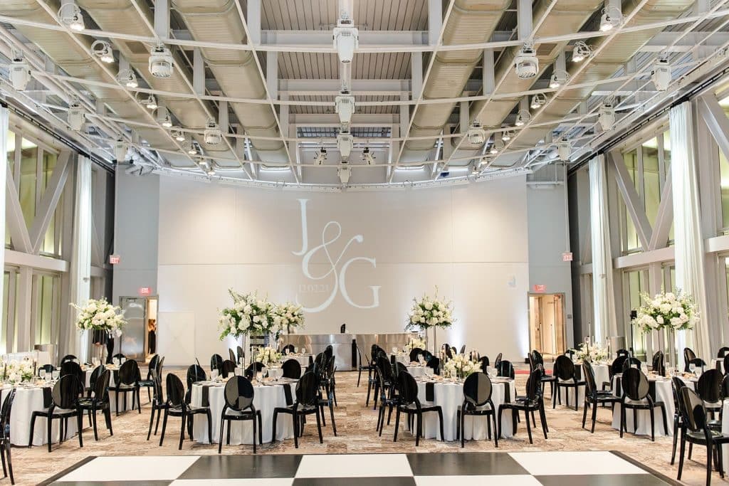 wedding reception, indoors, J&G, round tables, white tablecloths, black chairs, tall floral arrangements around the room, Dr. Phillips Center for Performing Arts, Orlando, FL