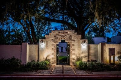 patio entrance, stone archway and fence, trees around, Orlando, FL