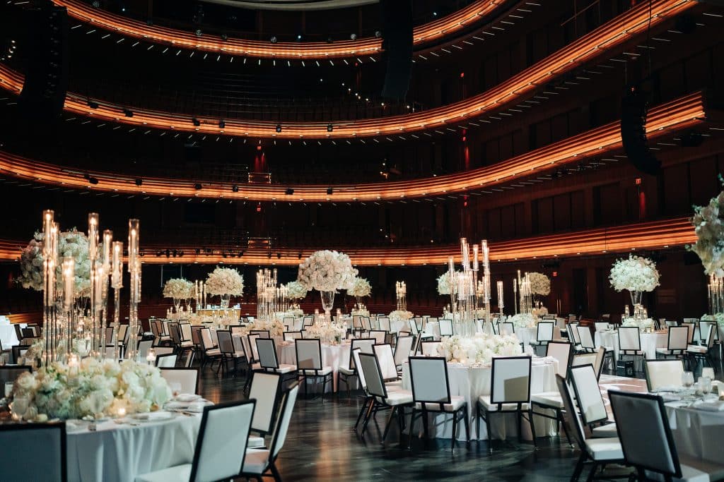 Dr. Phillips Center for Performing Arts, indoors, tables set with white tablecloths and tall candles in the center of each table, Orlando, FL