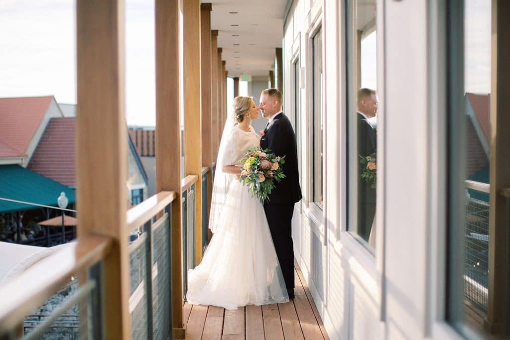 bride and groom embracing on the deck, wedding attire, Orlando, FL