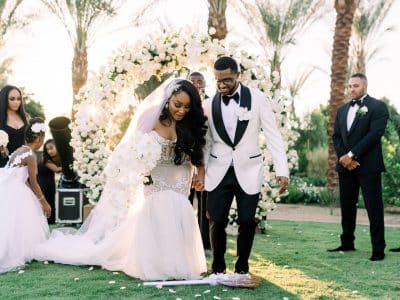 black couple jumping the broom at their wedding ceremony, Orlando, FL