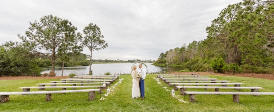 bride and groom, standing at their ceremony site on the golf course, Orlando, FL