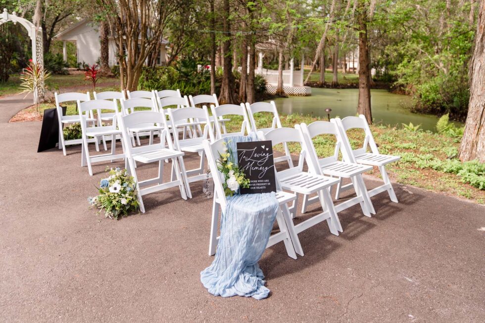 wedding ceremony set up, white chairs in rows, outside, Little Paradise Wedding Venue, Orlando, FL