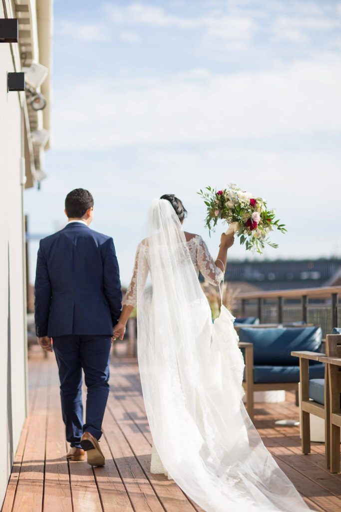 bride and groom walking along the deck, Paddlefish, Orlando, FL