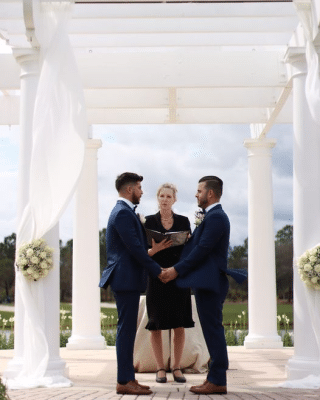 grooms getting married with their officiant, white altar, outdoors, Ritz-Carlton Orlando Grande Lakes, Orlando, FL