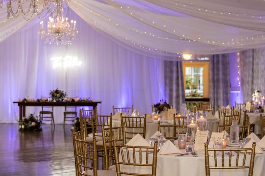 reception space indoors with burgundy and navy wedding colors