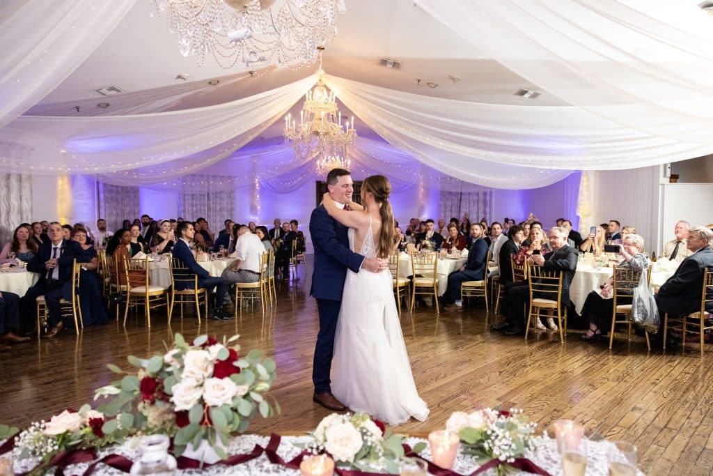 first dance as couple in burgandy and navy wedding