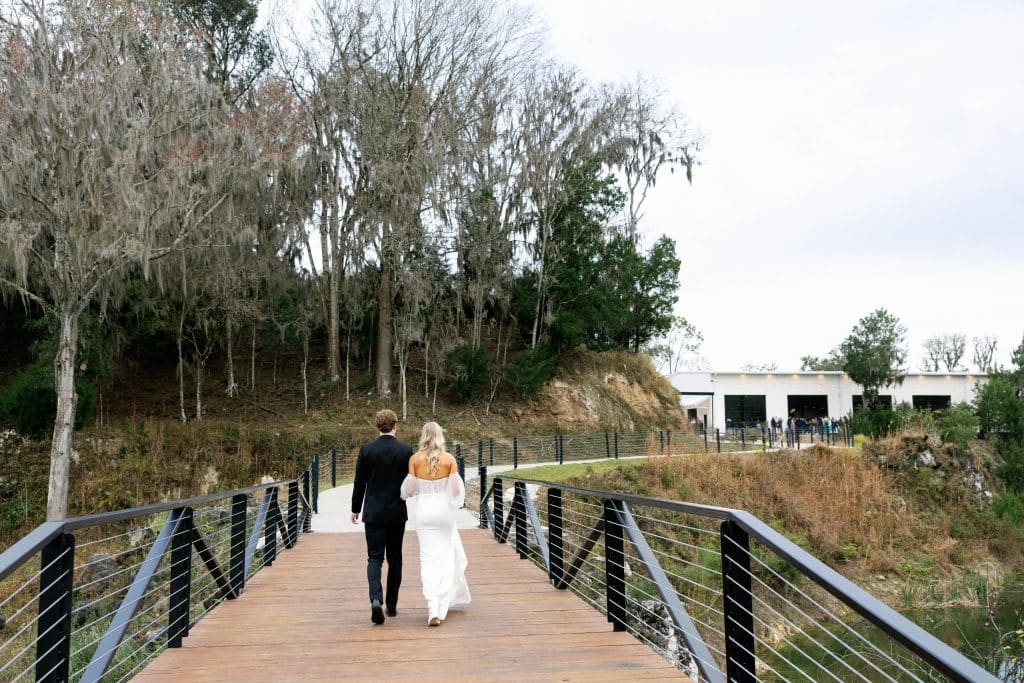 bride and groom walking on the bridge, White Rock Canyon, Orlando, FL