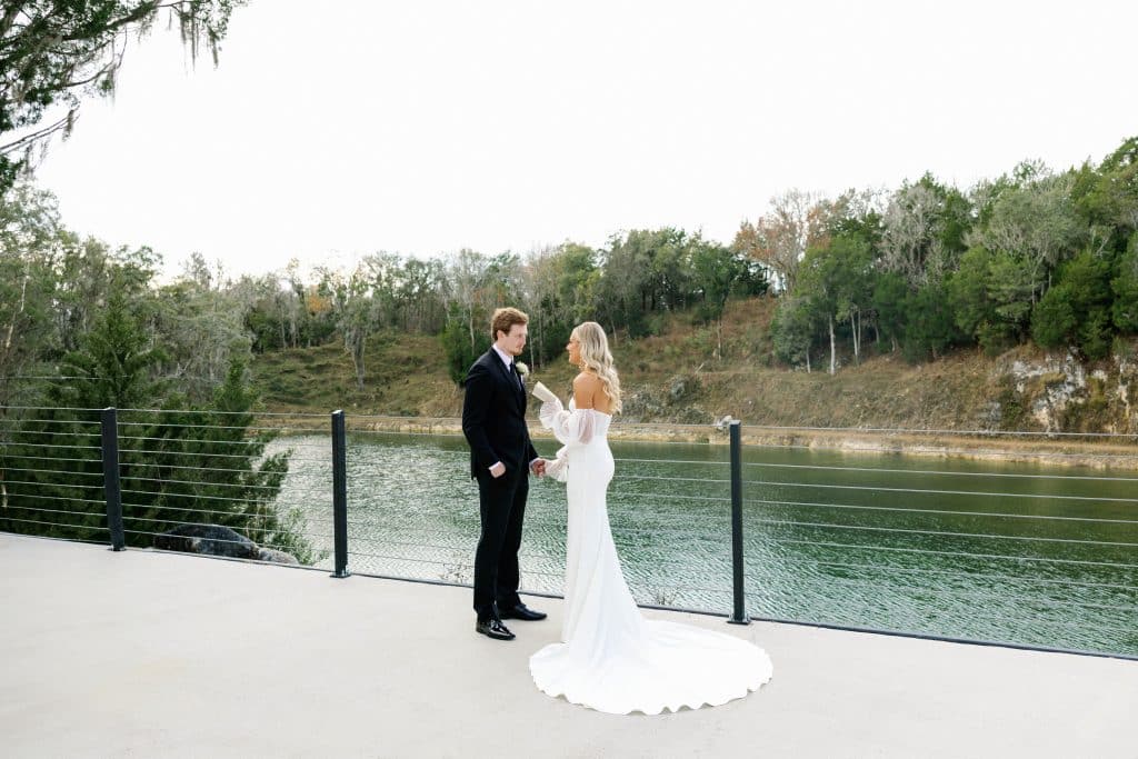 bride and groom looking at each other and the water, White Rock Canton, Orlando, FL