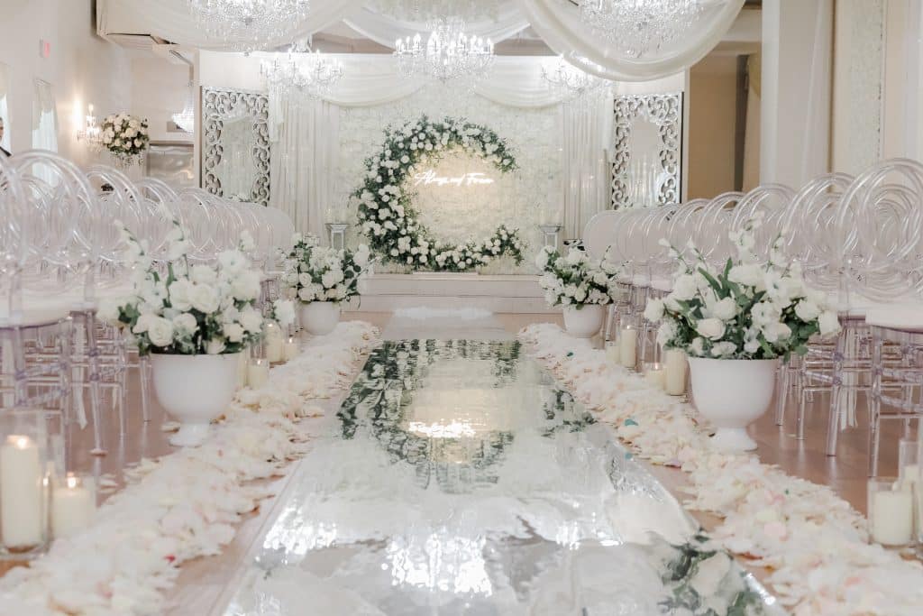 wedding ceremony, clear chairs, white flowers on the aisles and floor of the aisle, Orlando, FL