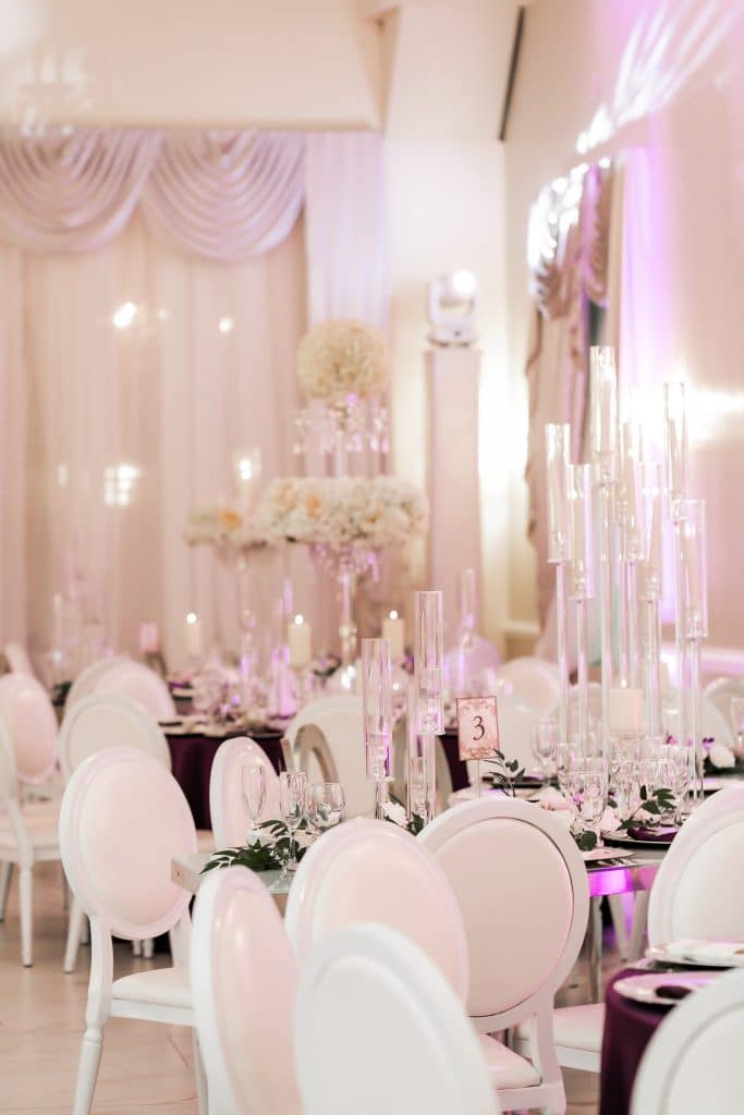 reception set up, white chairs, purple uplighting, Orlando, FL