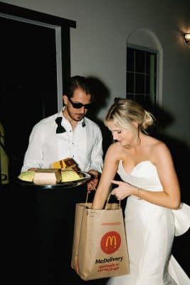 bride and groom getting McDonalds delivery while still wearing their wedding attire, Orlando, FL