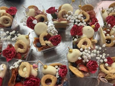 charcuterie cups with salami roses, baby's breath, Italian breadsticks, crackers, roses, Charcuterie and Bites, Orlando, FL