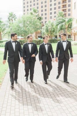 groomsmen talking together on a brick walkway, outside, palm trees, Rosen Shingle Creek, Orlando, FL