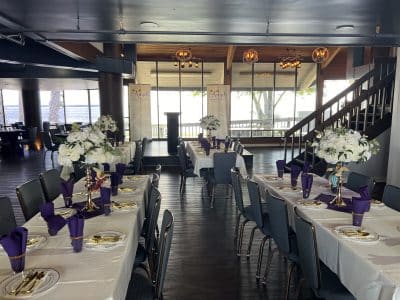 long tables for dinner reception, large white floral centerpieces, Sanford Galleon, Orlando, FL