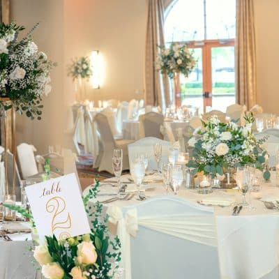 table number 2, tables set for a reception, white tablecloths, white back chairs with covers, Rosen Shingle Creek, Orlando, FL