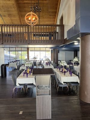 two long tables in the dining room at Sanford Galleon, view from the podium on stage, Orlando, FL