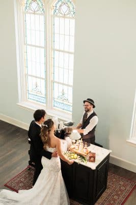 bride and groom at the bar waiting for their drinks to be made, wedding reception, Northwest Square Events, Orlando, FL