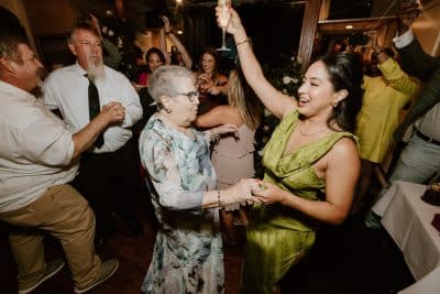 wedding guests dancing on the boat, celebrating the wedding couple, Orlando, FL