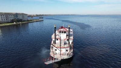 riverboat out on the open water, land to the west, clear skies, St. Johns Riverboat Co., Orlando, FL