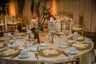 tablescape, reception, gold chargers, gold chairs, gold tablecloth, small trees as centerpieces, Rosen Centre, Orlando, FL