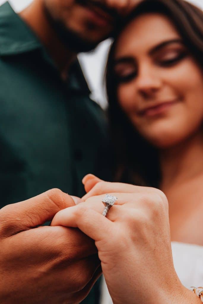 image with engaged couple showing off the engagement ring after their Italy marriage proposal