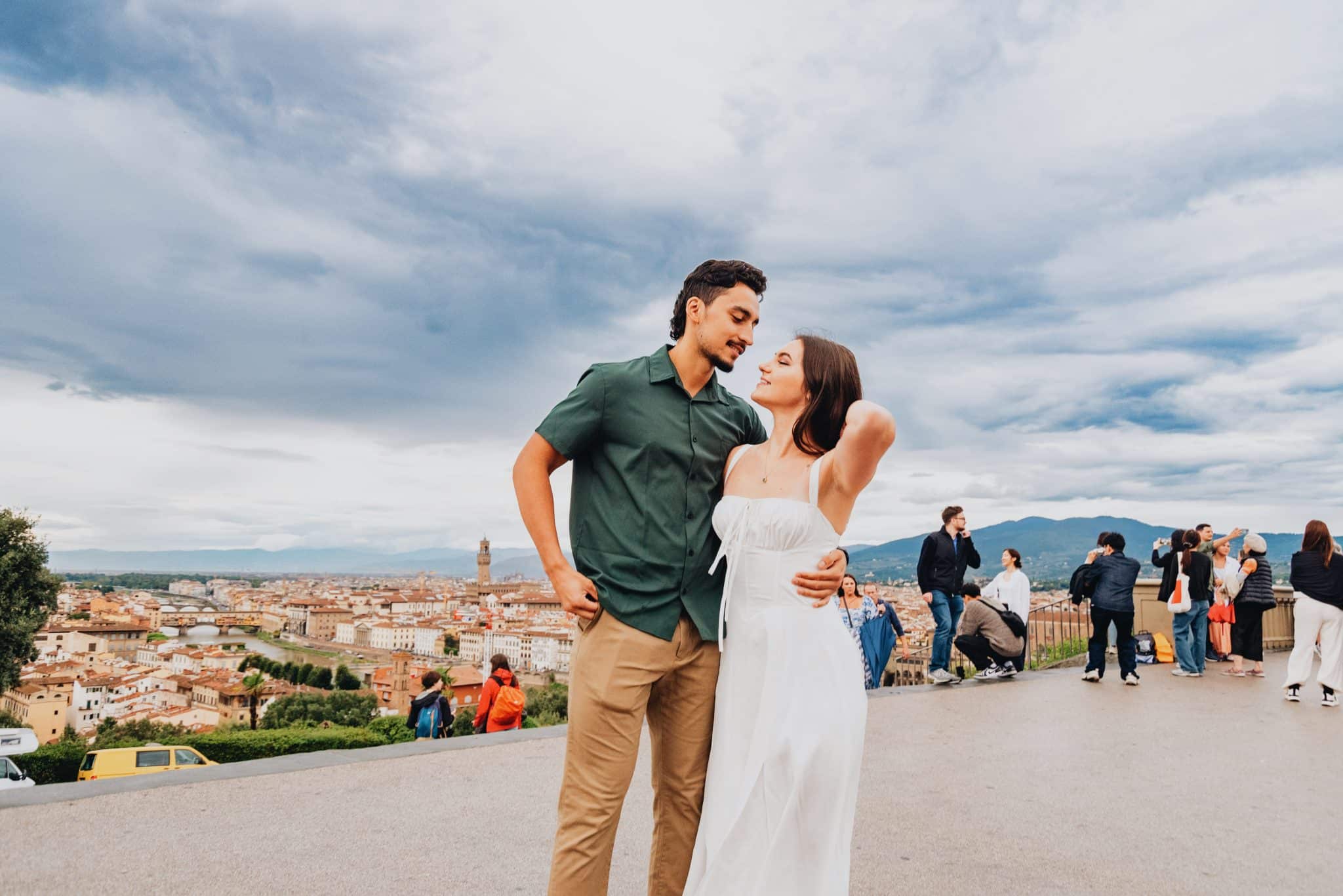 engaged couple posing for their engagement session in Italy