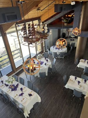 aerial view of the dining room, white tablecloth, large sliding doors, chandelier, Sanford Galleon, Orlando, FL