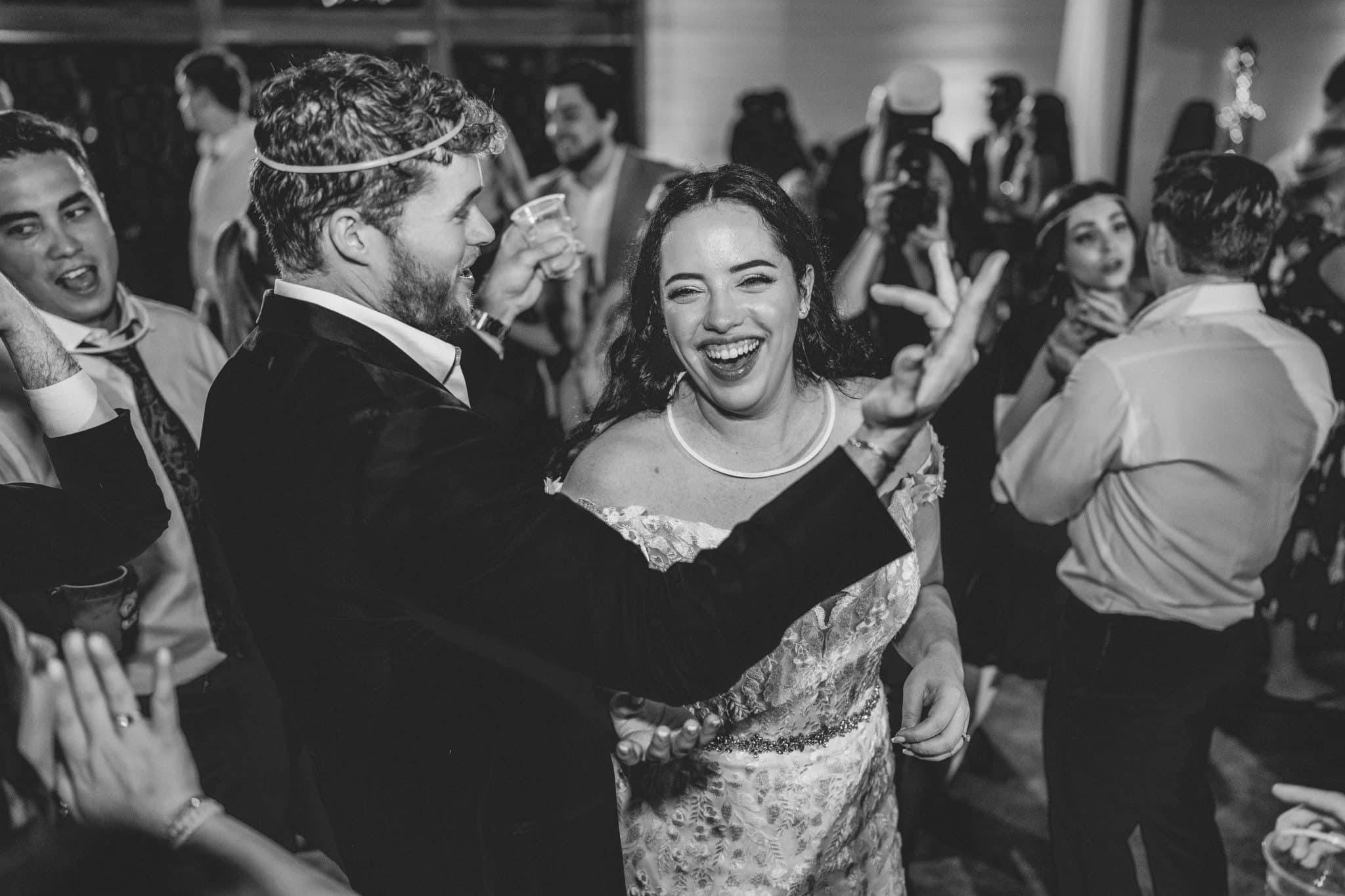 black and white image of the bride and groom dancing during reception