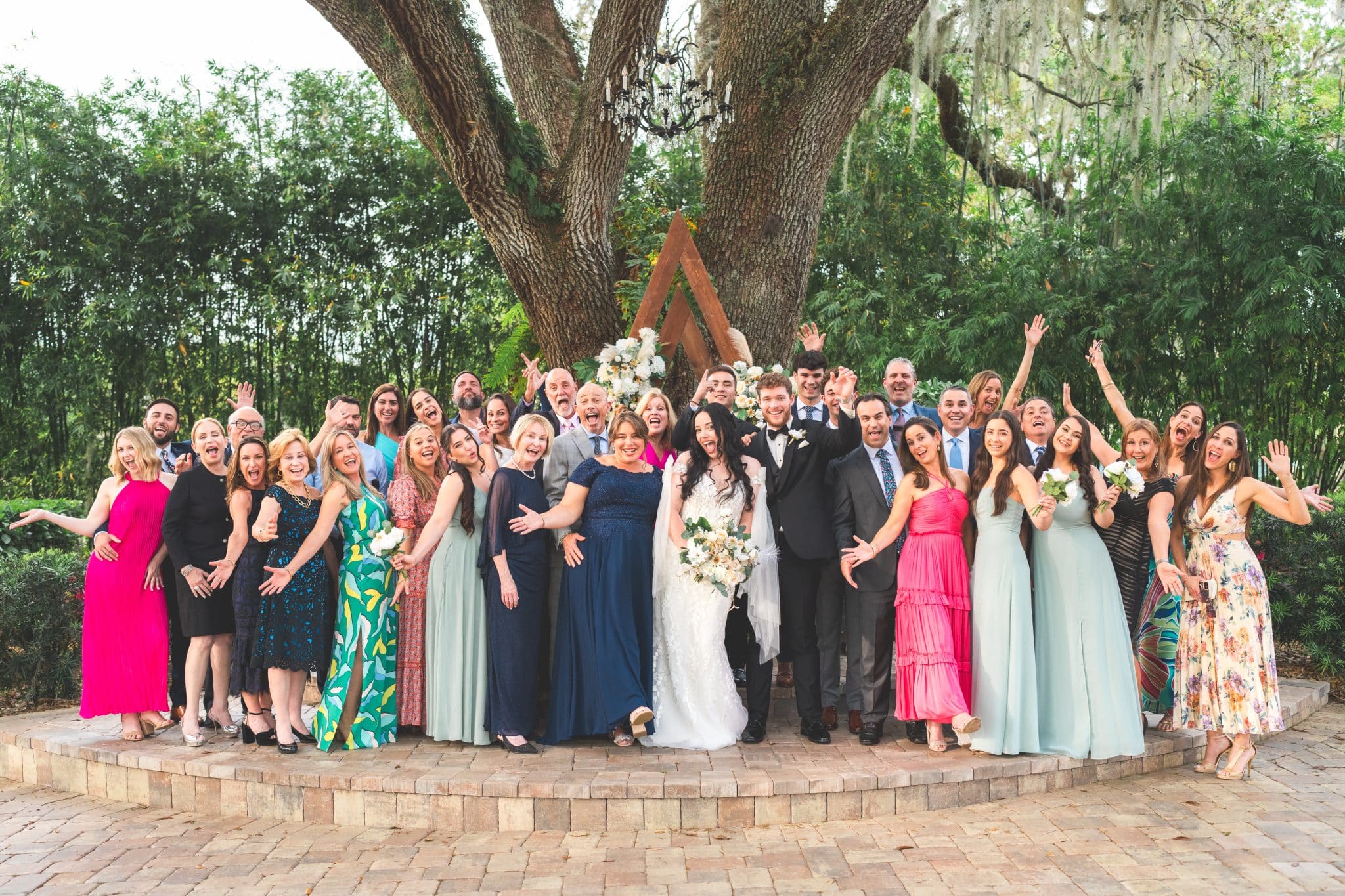 bride and groom during ceremony celebrating their forest farmhouse wedding with guests and family