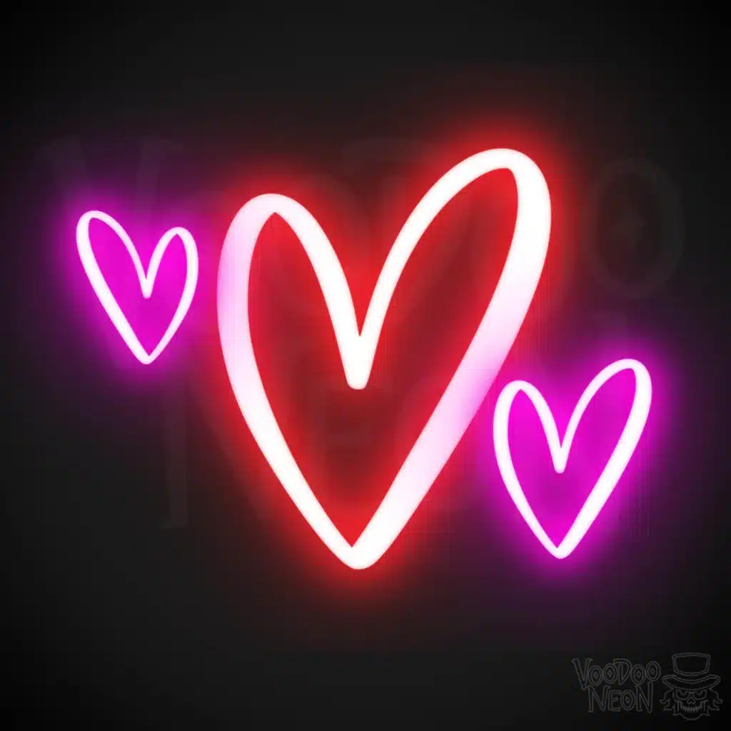 neon heart sign with red and pink hearts on a black background