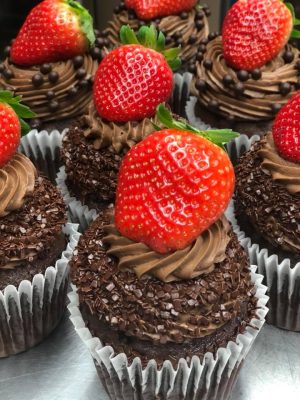 Chocolate cupcakes with chocolate frosting, topped with a strawberry, Orlando, FL