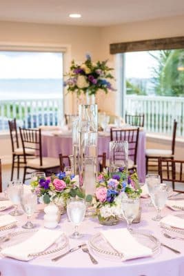 reception set up, lavender tablecloth, white napkins, near the water, Orlando, FL